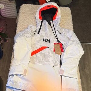 Helly Hansen womens POWERCHASER SNOW Camo Jacket with Orange Accents